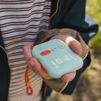 Waffle Go screen-free kids phone in mint, showing device buttons and display