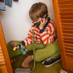 Boy using Waffle Home screen-free WiFi phone at home, approved contacts only