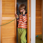 Boy making a call on Waffle Home screen-free kids phone, no apps no internet