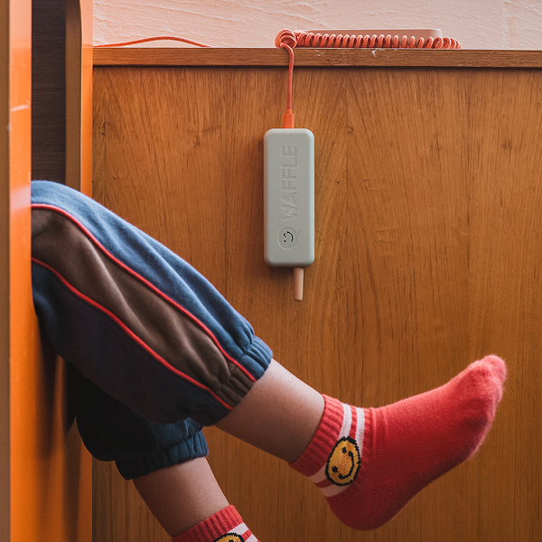 Waffle Home dangling by its cord